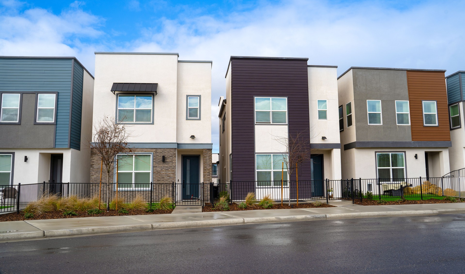 Front view of newly built rectangular townhomes